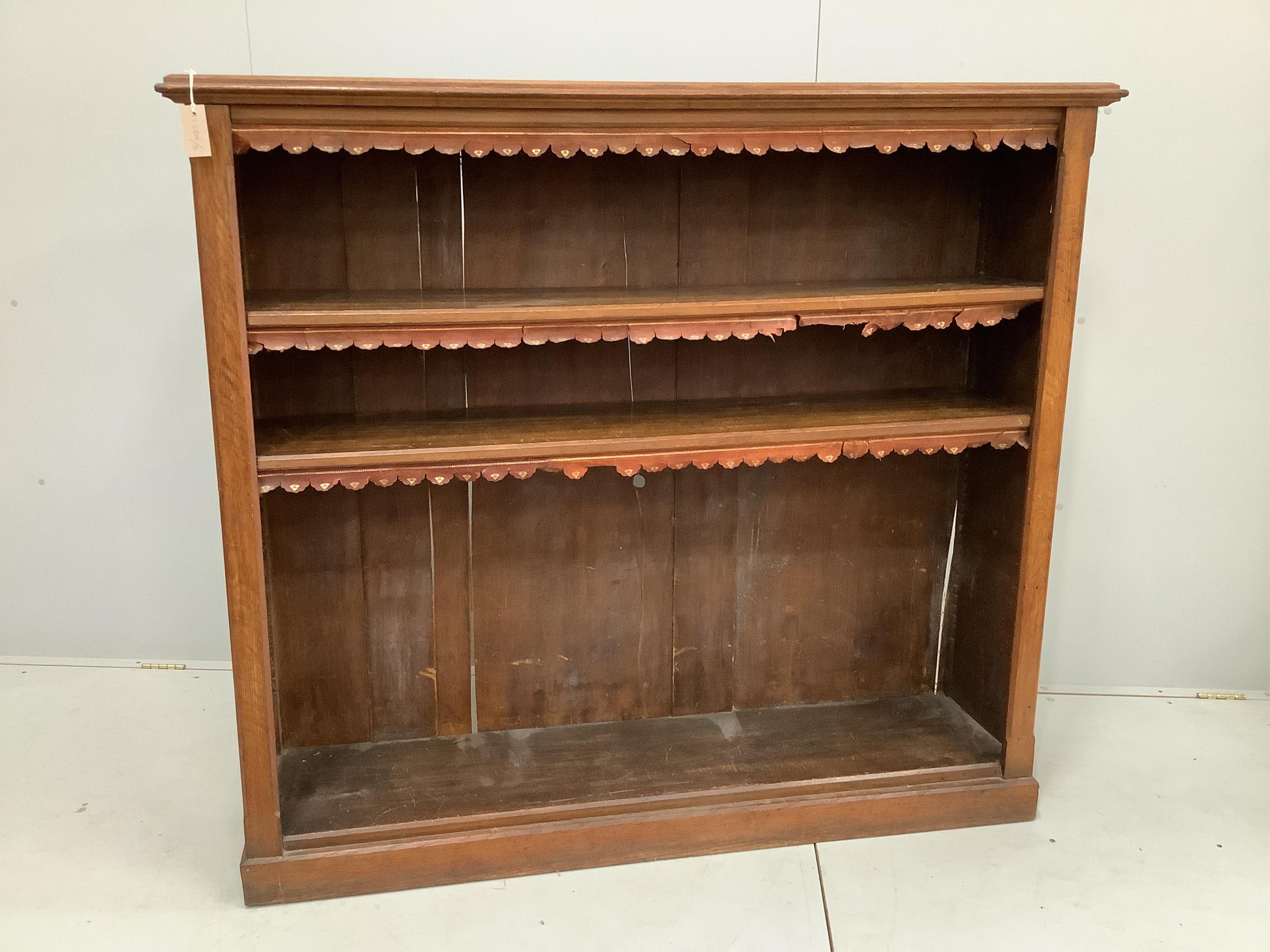An Edwardian oak open bookcase, width 152cm, depth 40cm, height 137cm. Condition - poor